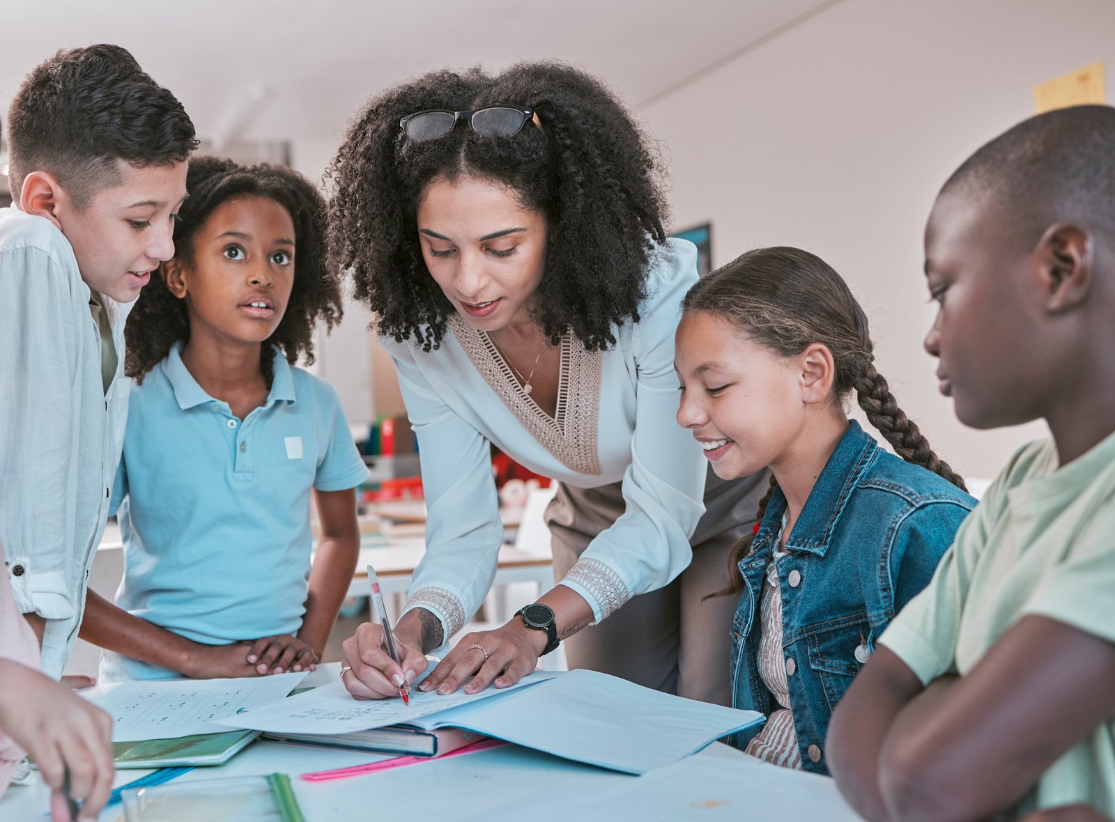 BrightPath teacher supporting a diverse group of primary-age students in class